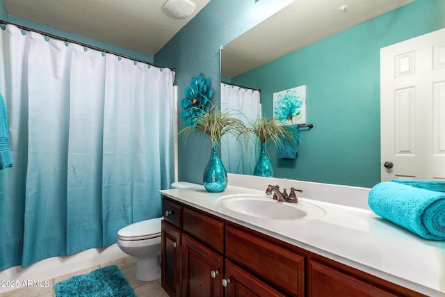 bathroom featuring vanity, toilet, and tile patterned floors