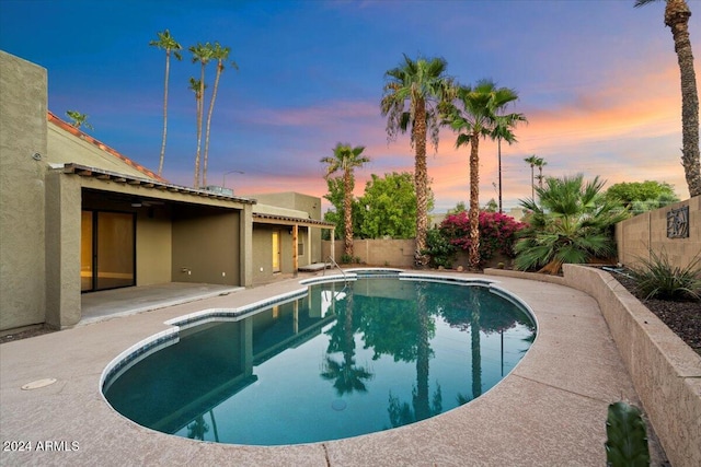 view of swimming pool with a fenced in pool, a fenced backyard, and a patio area