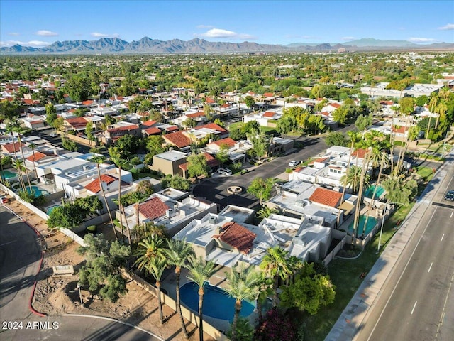 birds eye view of property with a mountain view and a residential view