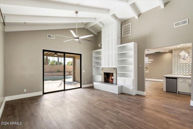 unfurnished living room with visible vents, baseboards, a ceiling fan, and wood finished floors