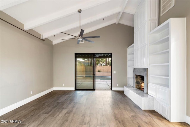 unfurnished living room featuring visible vents, baseboards, ceiling fan, a fireplace, and wood finished floors