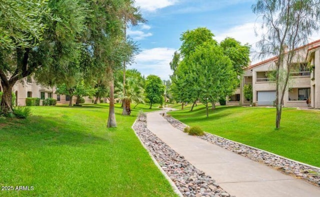 view of home's community featuring a yard