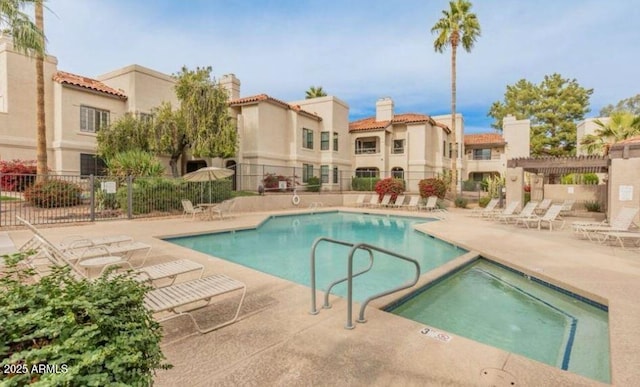 view of pool with a residential view, fence, a pergola, and a patio