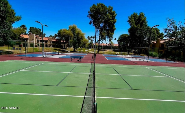 view of sport court with fence