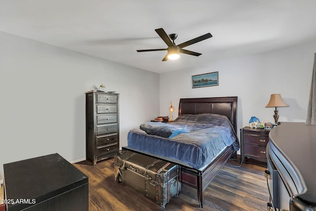 bedroom featuring dark wood-type flooring, ceiling fan, and baseboards