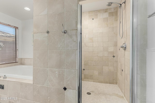 bathroom featuring a shower stall, recessed lighting, and a garden tub