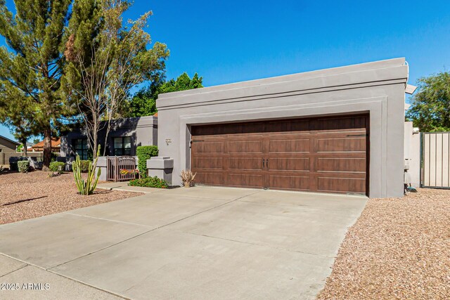 exterior space featuring fence and stucco siding