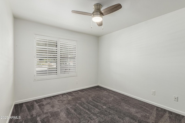 empty room with baseboards, ceiling fan, and dark carpet