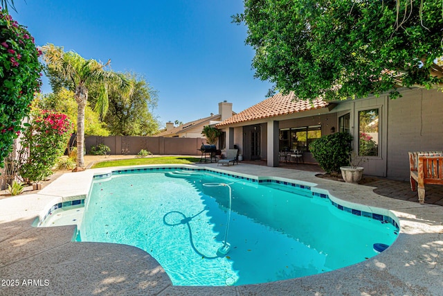 view of pool with a fenced in pool, a fenced backyard, and a patio area