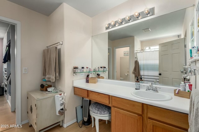 bathroom featuring vanity and baseboards