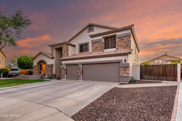 7029 E Monte Cir, Mesa, AZ 85209 - mediterranean / spanish house featuring stone siding, a garage, and stucco siding