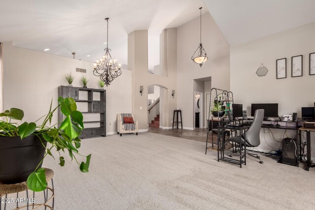 7029 E Monte Cir, Mesa, AZ 85209 - dining room featuring carpet flooring, a high ceiling, a desk, baseboards, and a chandelier