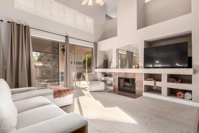 7029 E Monte Cir, Mesa, AZ 85209 - living room with healthy amount of natural light, carpet floors, built in shelves, and a fireplace