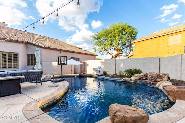 7029 E Monte Cir, Mesa, AZ 85209 - view of pool featuring a fenced backyard, a patio, and an outdoor hangout area