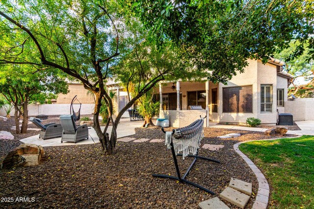 7029 E Monte Cir, Mesa, AZ 85209 - rear view of house with a patio area, stucco siding, ceiling fan, and central AC