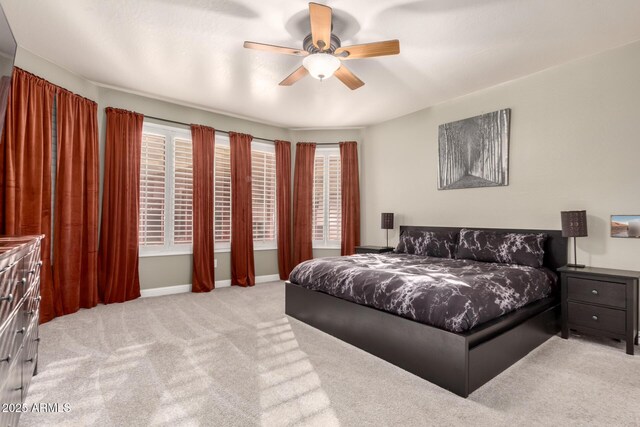 7029 E Monte Cir, Mesa, AZ 85209 - carpeted bedroom featuring ceiling fan and baseboards