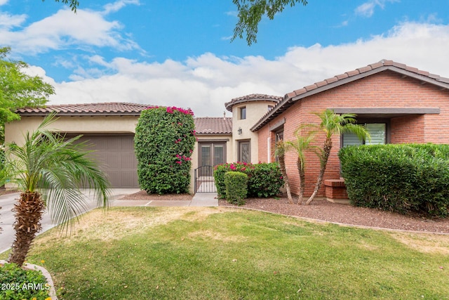 20532 W Summit Pl, Buckeye, AZ 85396 - mediterranean / spanish-style house with a tiled roof, an attached garage, a front lawn, and brick siding