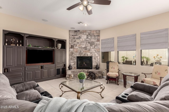 20532 W Summit Pl, Buckeye, AZ 85396 - living area with light tile patterned flooring, a ceiling fan, and a stone fireplace