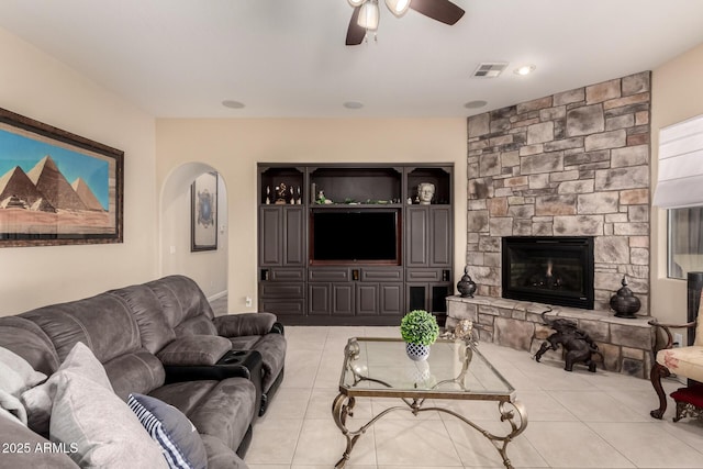 20532 W Summit Pl, Buckeye, AZ 85396 - living area featuring a ceiling fan, light tile patterned floors, and a fireplace