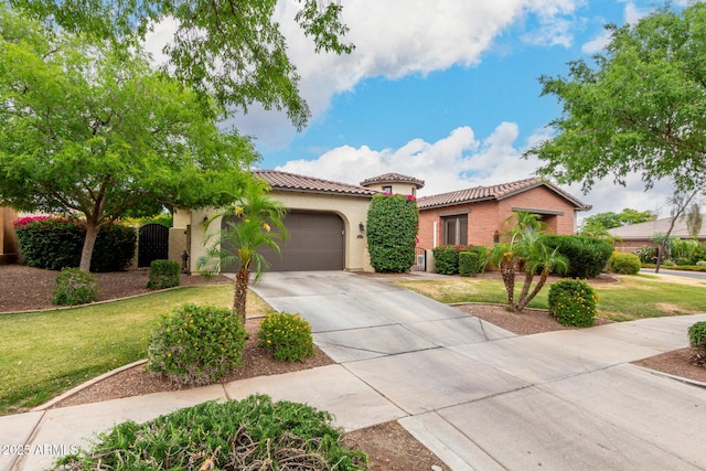 20532 W Summit Pl, Buckeye, AZ 85396 - mediterranean / spanish house with a tiled roof, a garage, driveway, stucco siding, and a front lawn