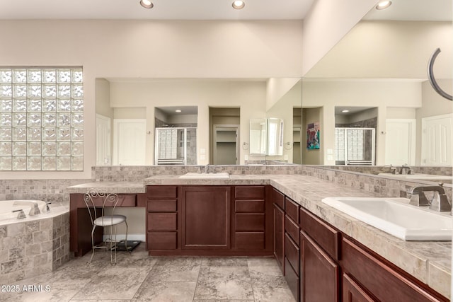 20532 W Summit Pl, Buckeye, AZ 85396 - full bathroom featuring a stall shower, double vanity, recessed lighting, and a garden tub
