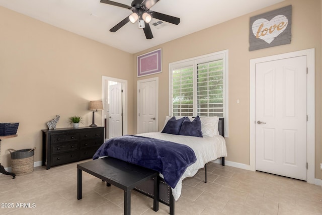 20532 W Summit Pl, Buckeye, AZ 85396 - bedroom with baseboards, light tile patterned floors, and a ceiling fan
