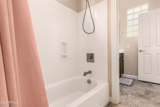 20532 W Summit Pl, Buckeye, AZ 85396 - bathroom featuring shower / bath combination, healthy amount of natural light, vanity, and baseboards