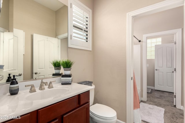 20532 W Summit Pl, Buckeye, AZ 85396 - bathroom with vanity, toilet, and baseboards
