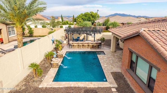 20532 W Summit Pl, Buckeye, AZ 85396 - view of swimming pool featuring a fenced backyard, a pergola, a mountain view, and a patio area