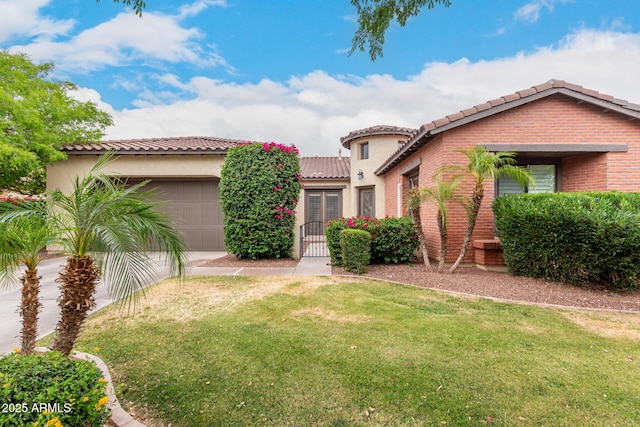 20532 W Summit Pl, Buckeye, AZ 85396 - mediterranean / spanish home with a tile roof, a garage, a front lawn, and concrete driveway