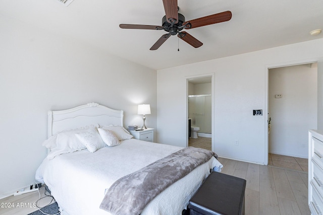 bedroom with light hardwood / wood-style floors, ceiling fan, and ensuite bathroom