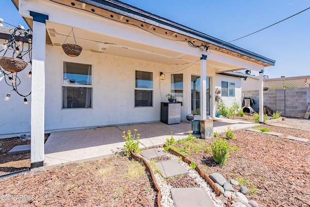 back of property featuring a patio