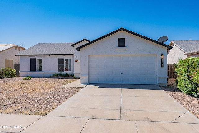 single story home with a garage