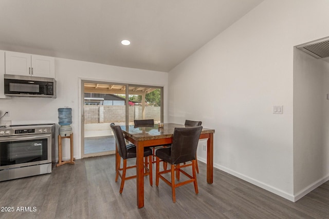 2826 E Cactus Rd, Phoenix, AZ 85032 - dining area featuring dark wood-style flooring, recessed lighting, and vaulted ceiling