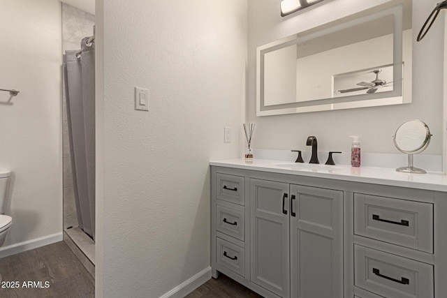 2826 E Cactus Rd, Phoenix, AZ 85032 - full bath with vanity, wood finished floors, a ceiling fan, and a shower with shower curtain