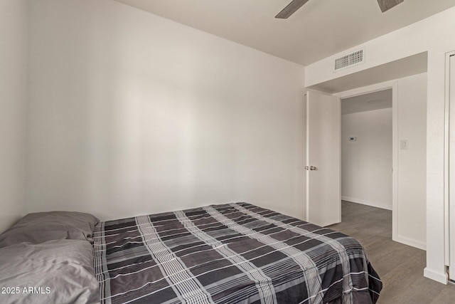 2826 E Cactus Rd, Phoenix, AZ 85032 - bedroom featuring wood finished floors and a ceiling fan