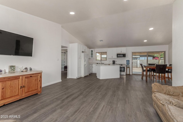 2826 E Cactus Rd, Phoenix, AZ 85032 - living area featuring dark wood finished floors, vaulted ceiling, and recessed lighting