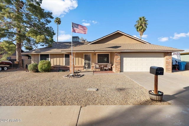 ranch-style home featuring a garage