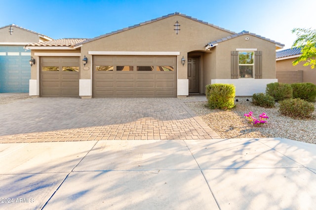 view of front of property with a garage