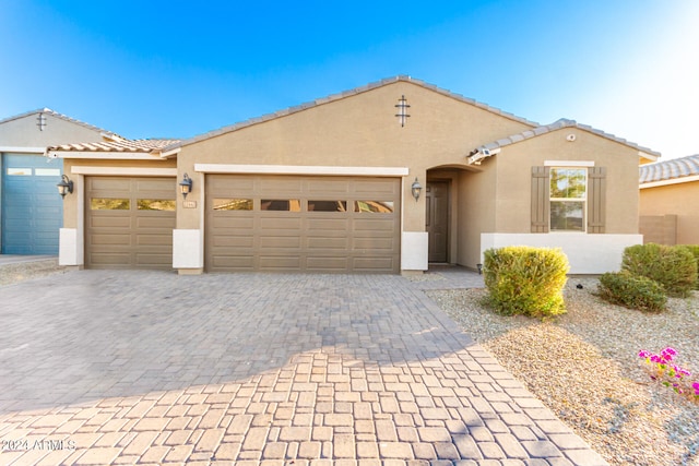 view of front of property with a garage