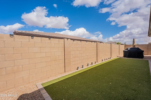 view of yard featuring a fenced backyard