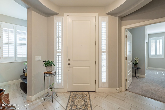 foyer entrance with baseboards