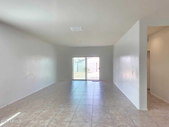 unfurnished room featuring light tile patterned floors