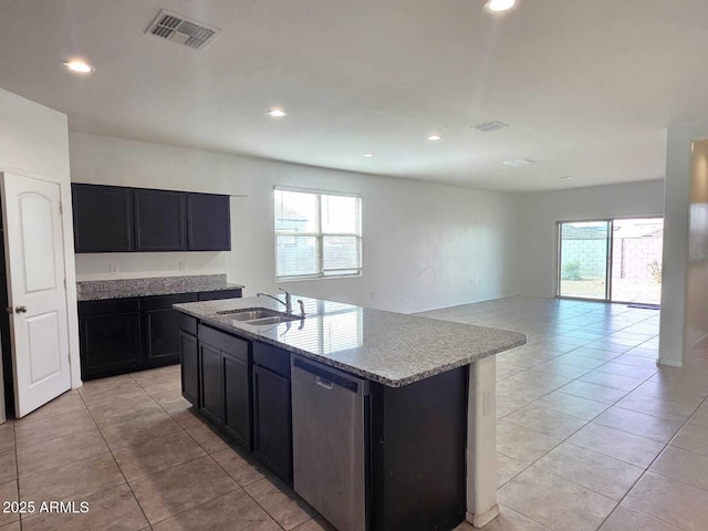 kitchen with recessed lighting, visible vents, stainless steel dishwasher, open floor plan, and a sink