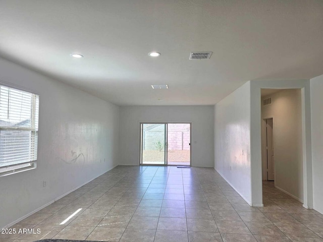 spare room featuring recessed lighting, visible vents, and light tile patterned flooring