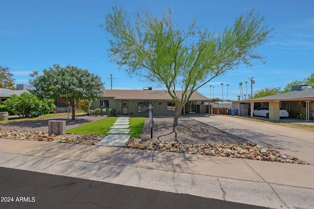 ranch-style house with a carport