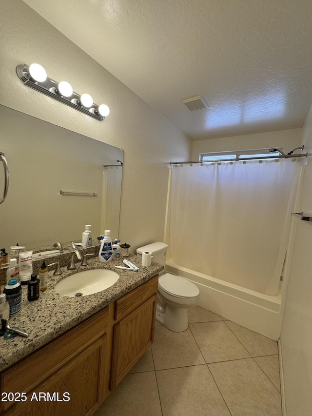 bathroom with shower / bath combination with curtain, visible vents, a textured ceiling, vanity, and tile patterned flooring