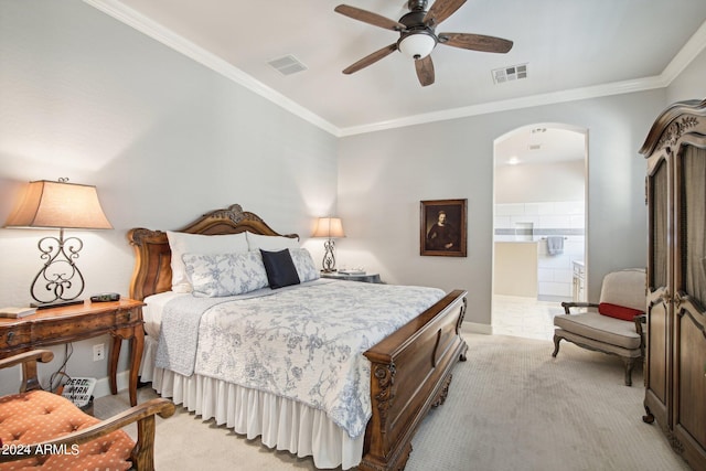 carpeted bedroom with ornamental molding, ensuite bath, and ceiling fan