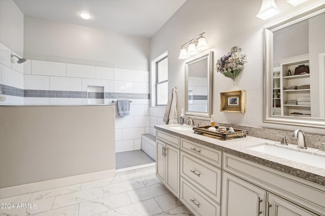 bathroom with walk in shower and vanity