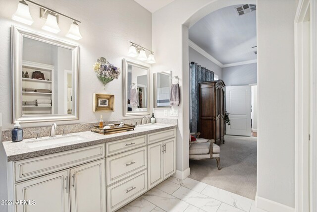 bathroom with vanity and crown molding